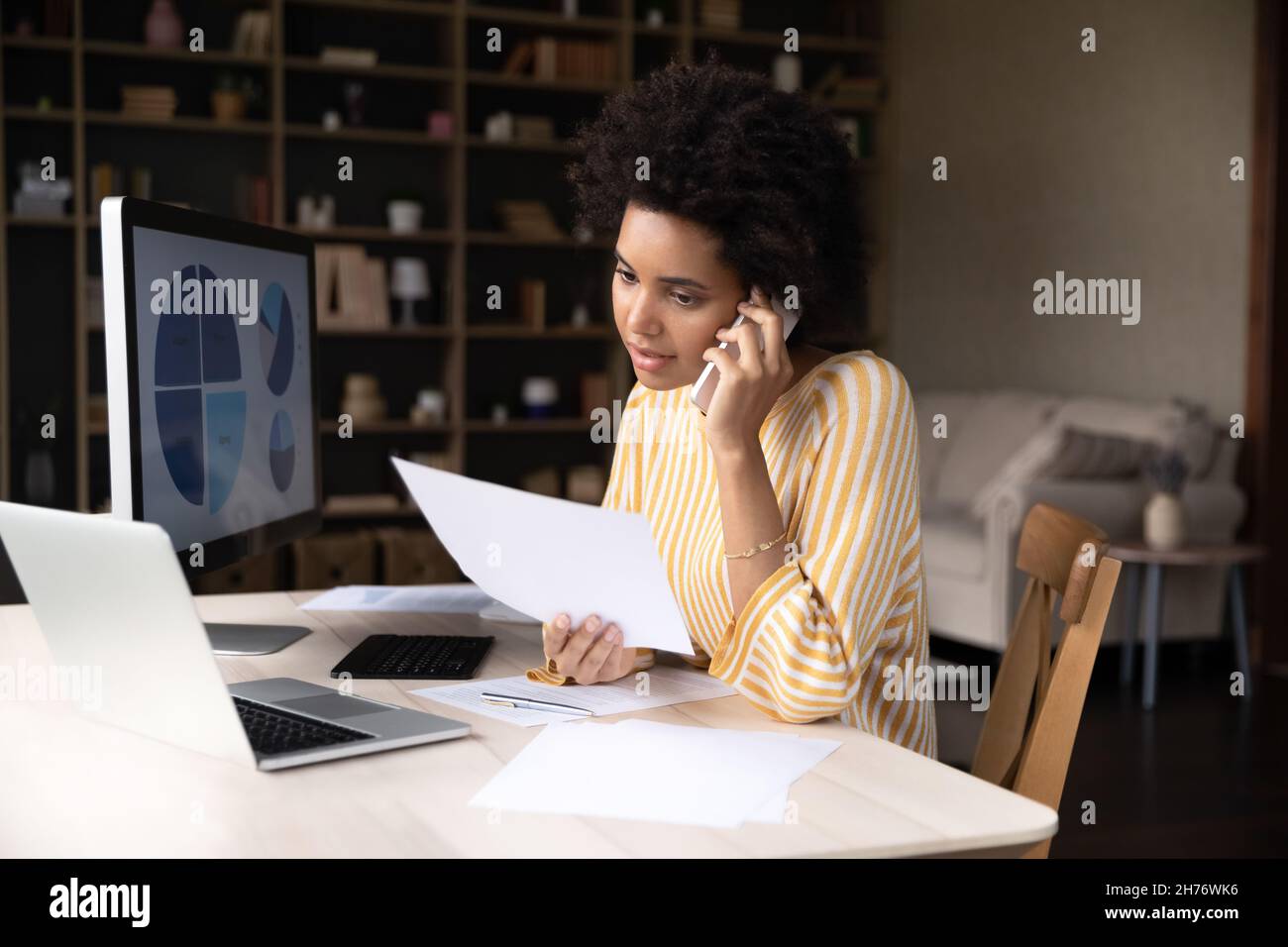 Focused African American business woman working from home Stock Photo ...