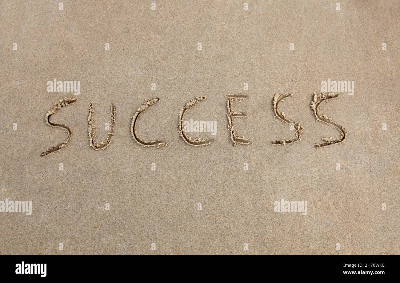 Success written in the sand at the beach Stock Photo