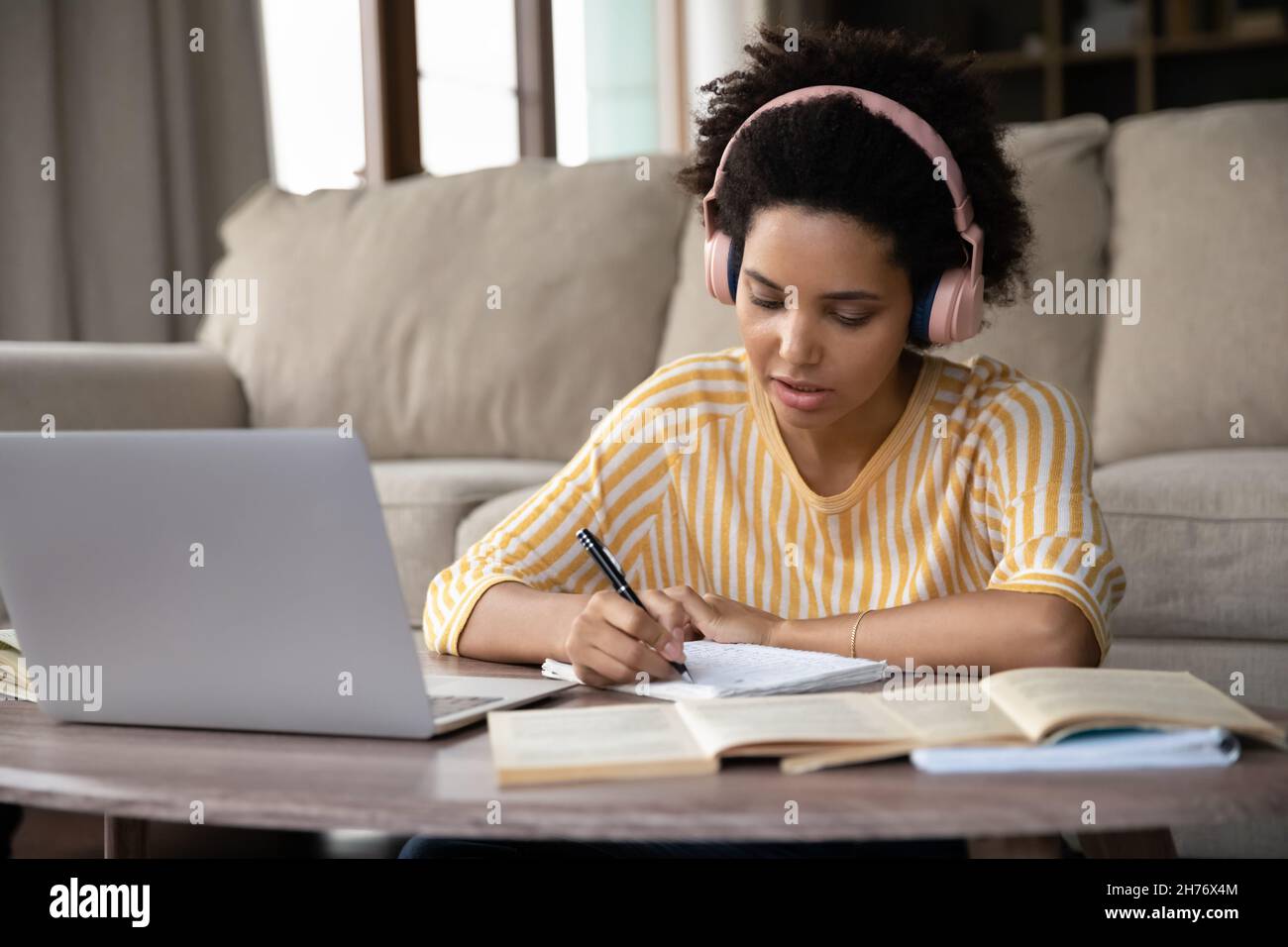 Serious young African Student girl in wireless headphones Stock Photo ...