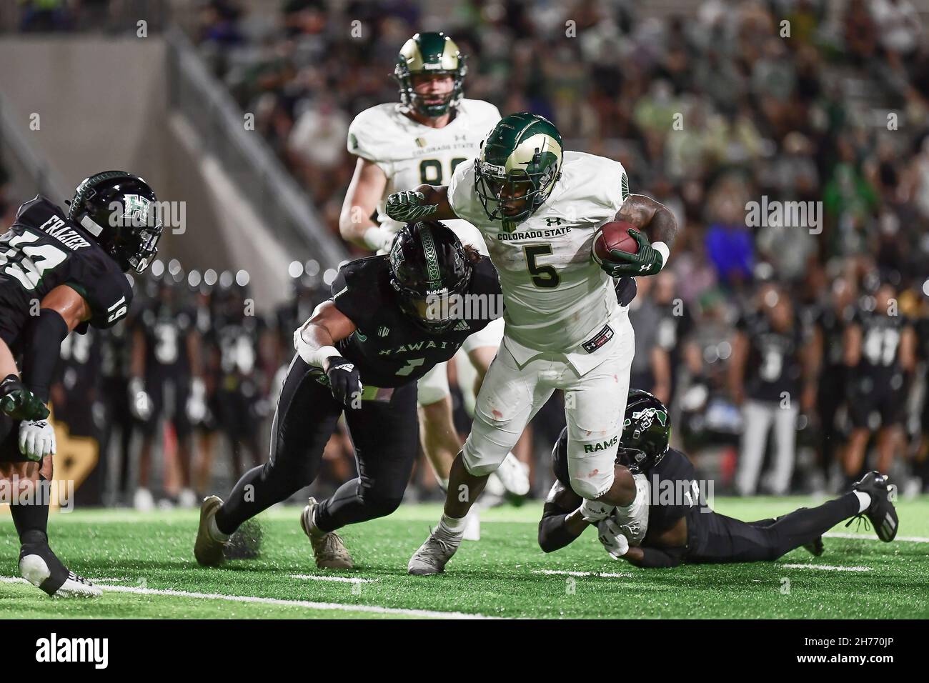 Honolulu, Hawaii, USA. 20th Nov, 2021. Colorado State Rams running back DAVID BAILEY (5) was tackled by Hawaii Warriors linebacker PENEI PAVIHI (1) during a game between the Colorado State Rams and Hawaii Rainbow Warriors played at Clarence T.C. Ching Field Manoa Campus, Honolulu, Hawaii. (Credit Image: © Steven Erler/ZUMA Press Wire) Stock Photo