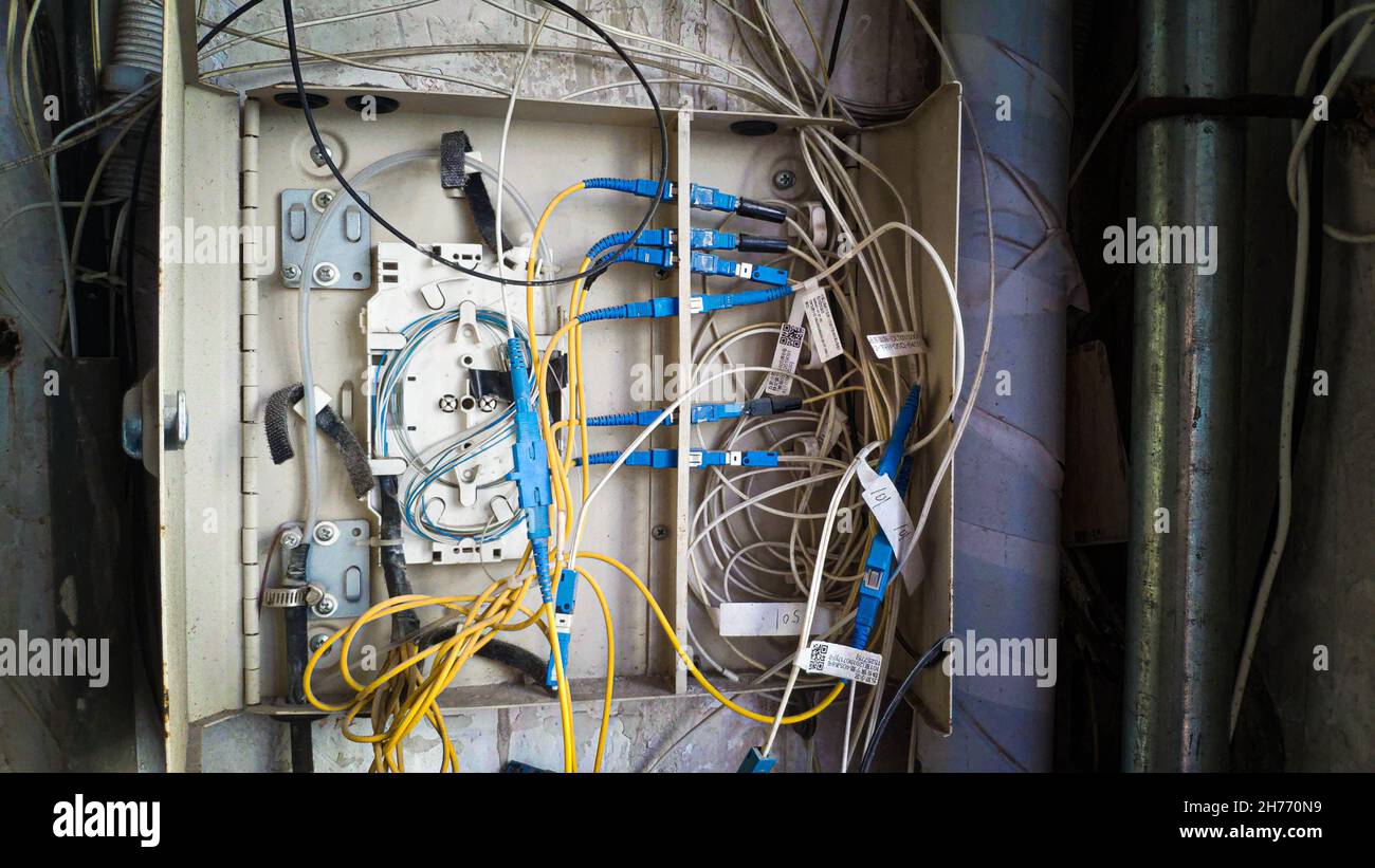 Electrical terminal in junction box open and broken with exposed wires, China Stock Photo