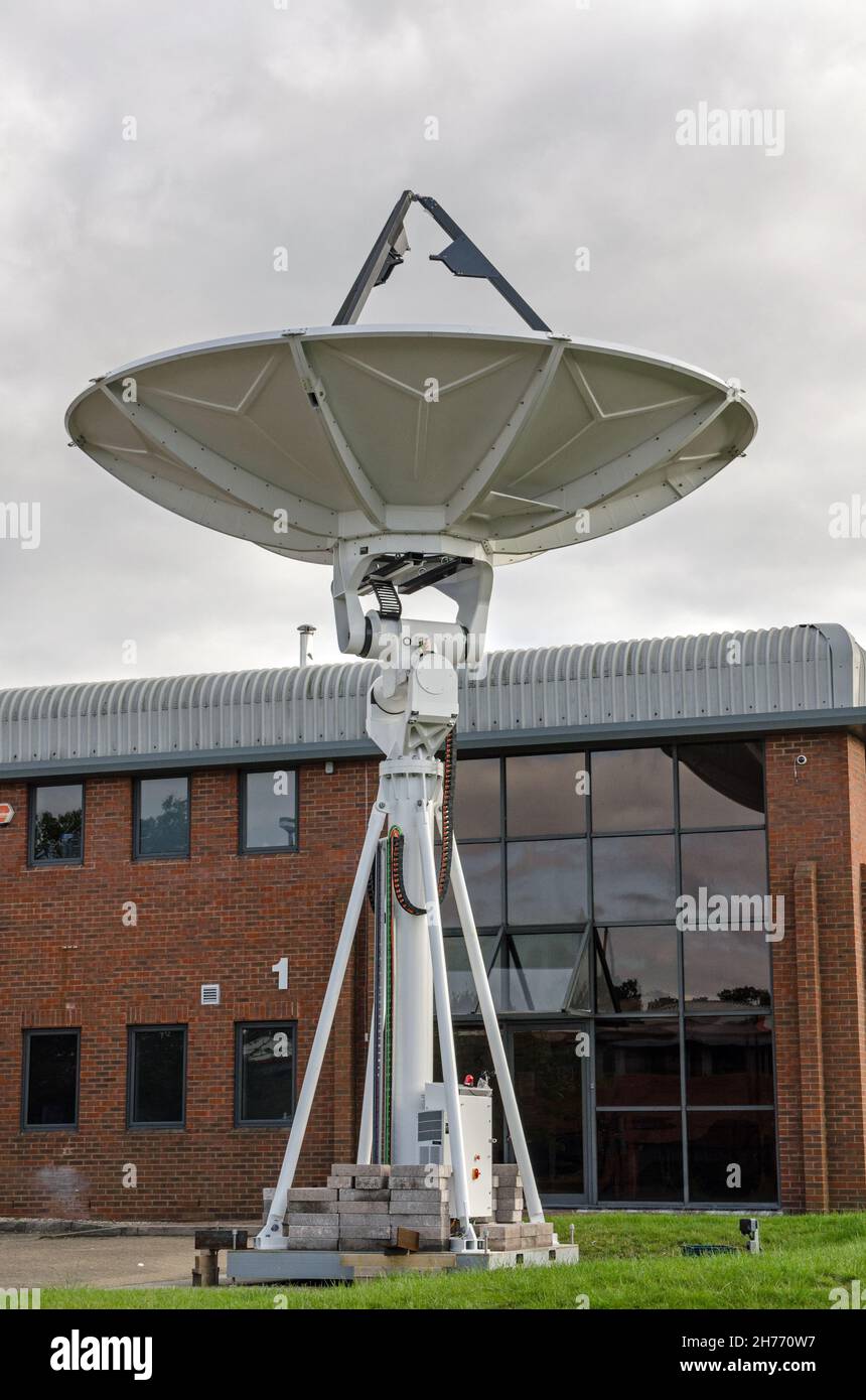 A large satellite dish providing a ground systems uplink for telecommunications in Chineham, Basingstoke, Hampshire. Stock Photo