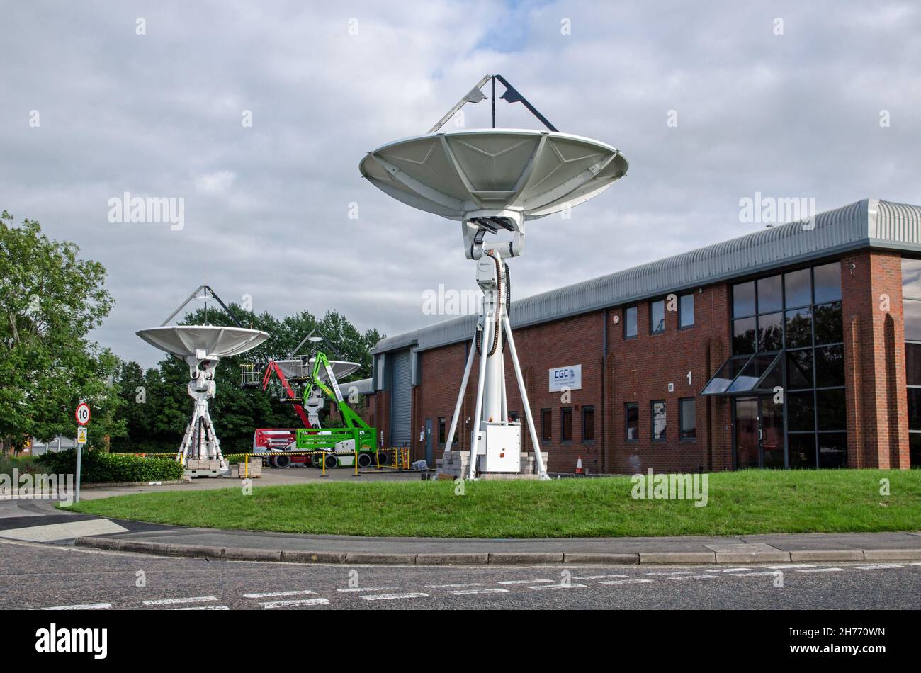 Basingstoke, UK - July 3, 2021: Satellite uplink dishes outside the offices of CGC Technology Systems, now part of Comtech Ground Systems in the Chine Stock Photo