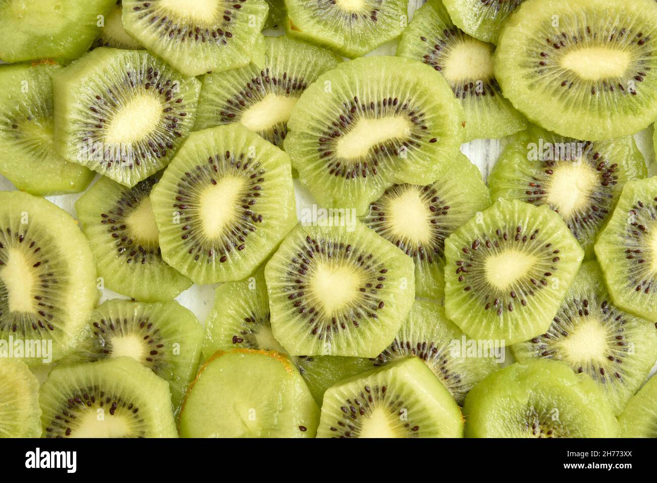 Overhead view of kiwi slices on a table Stock Photo