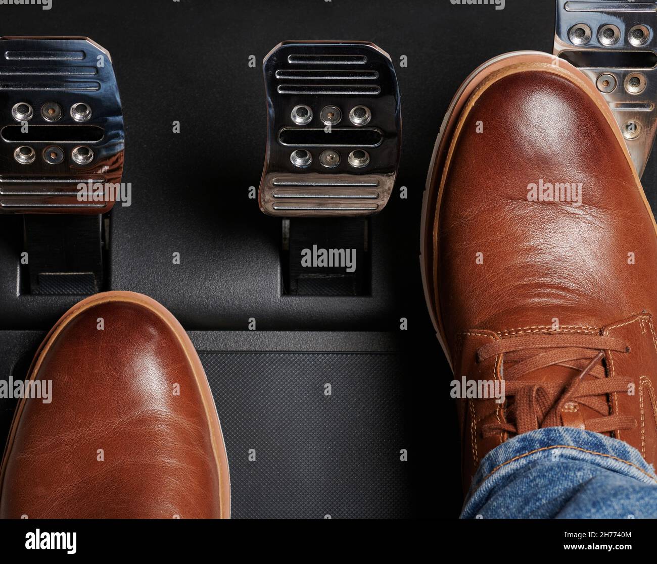 Press throttle pedal in car via man in leather shoes Stock Photo Alamy