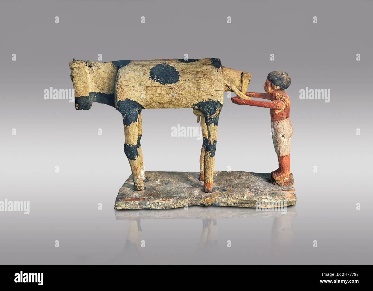 Ancient Egyptian wooden tomb model of a calving cow, 1900-1786 BC,, 12th Dynasty, Asyut. Museum of Fine Arts of Lyon inv 1969-409. Painted sucamore wo Stock Photo