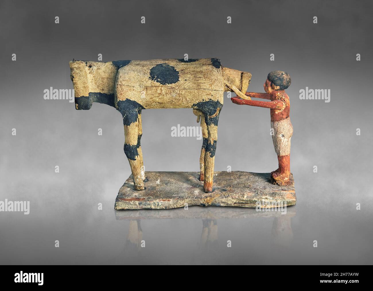 Ancient Egyptian wooden tomb model of a calving cow, 1900-1786 BC,, 12th Dynasty, Asyut. Museum of Fine Arts of Lyon inv 1969-409. Painted sucamore wo Stock Photo