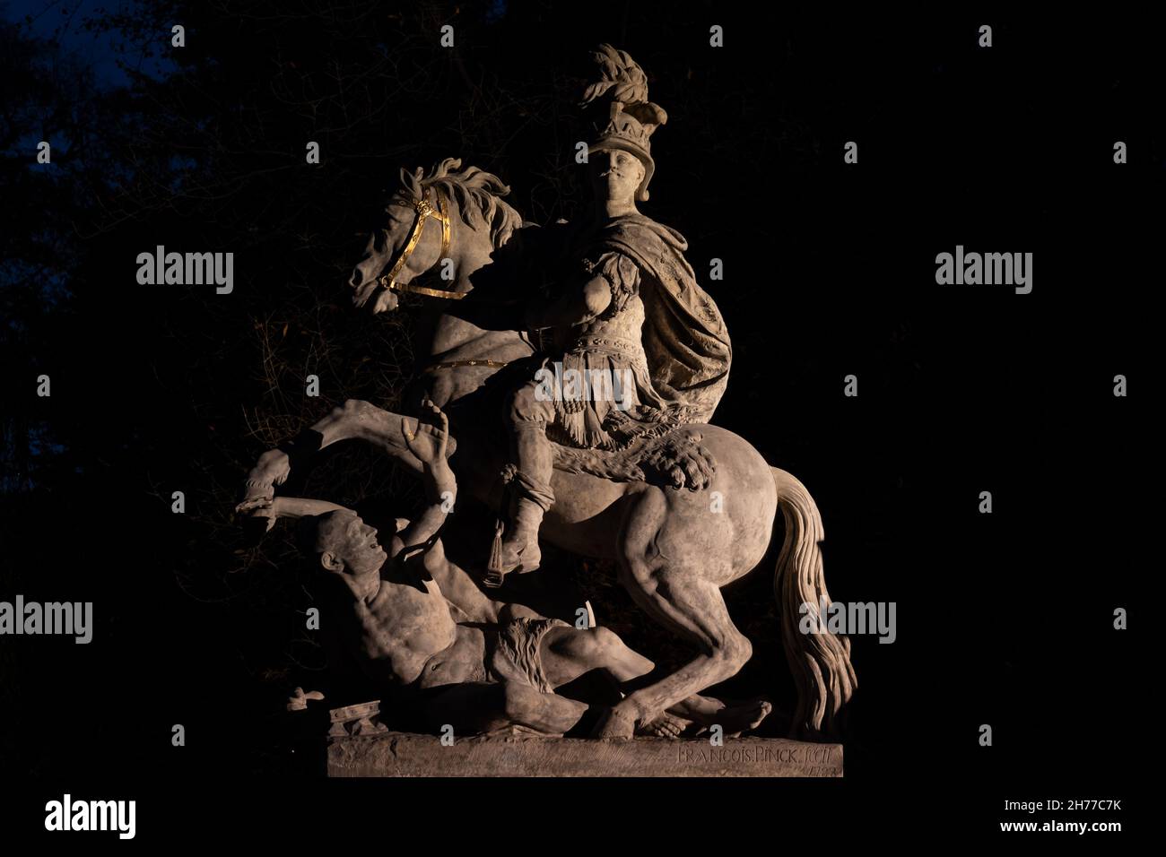 King Jan III Sobieski monument illuminated at night in city of Warsaw, Poland. Baroque equestrian statue from 1788. Stock Photo