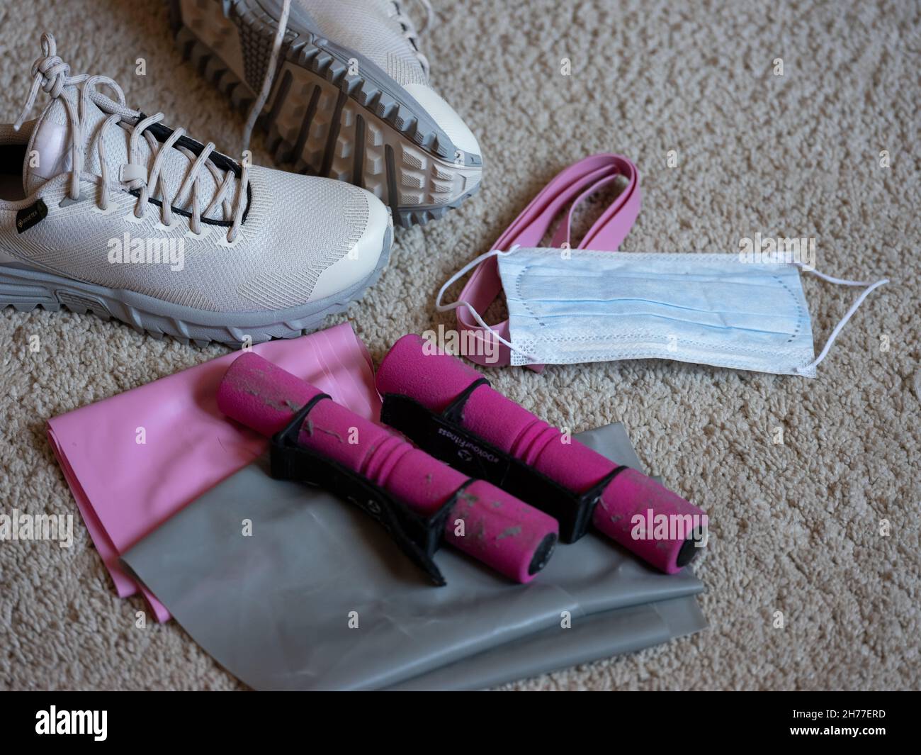 Sports Utensils and Shoes with Corona Mask on the floor Stock Photo