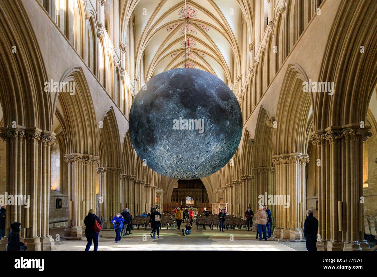 In autumn 2021 a giant moon by Bristol artist Luke Jerram was suspended in Wells Cathedral nave, Somerset, celebrating the Festival of the Moon. Stock Photo