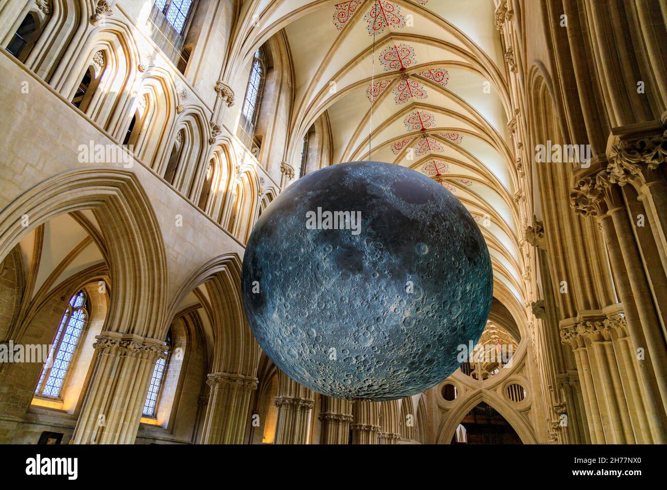 In autumn 2021 a giant moon by Bristol artist Luke Jerram was suspended in Wells Cathedral nave, Somerset, celebrating the Festival of the Moon. Stock Photo