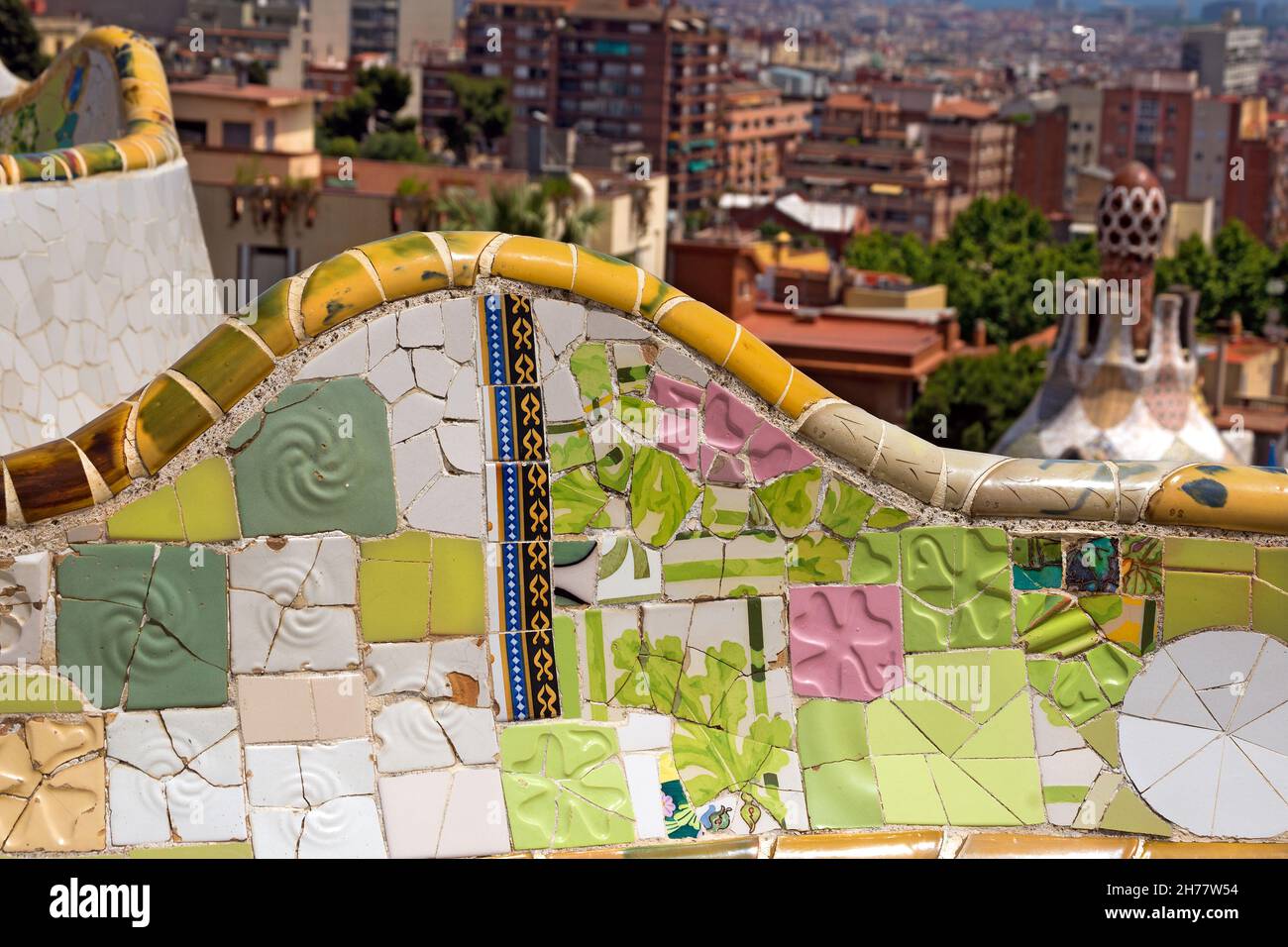 Ceramic bench and building in the Park Guell designed by the famous architect Antoni Gaudi (1852-1926). UNESCO, World Heritage Site Stock Photo