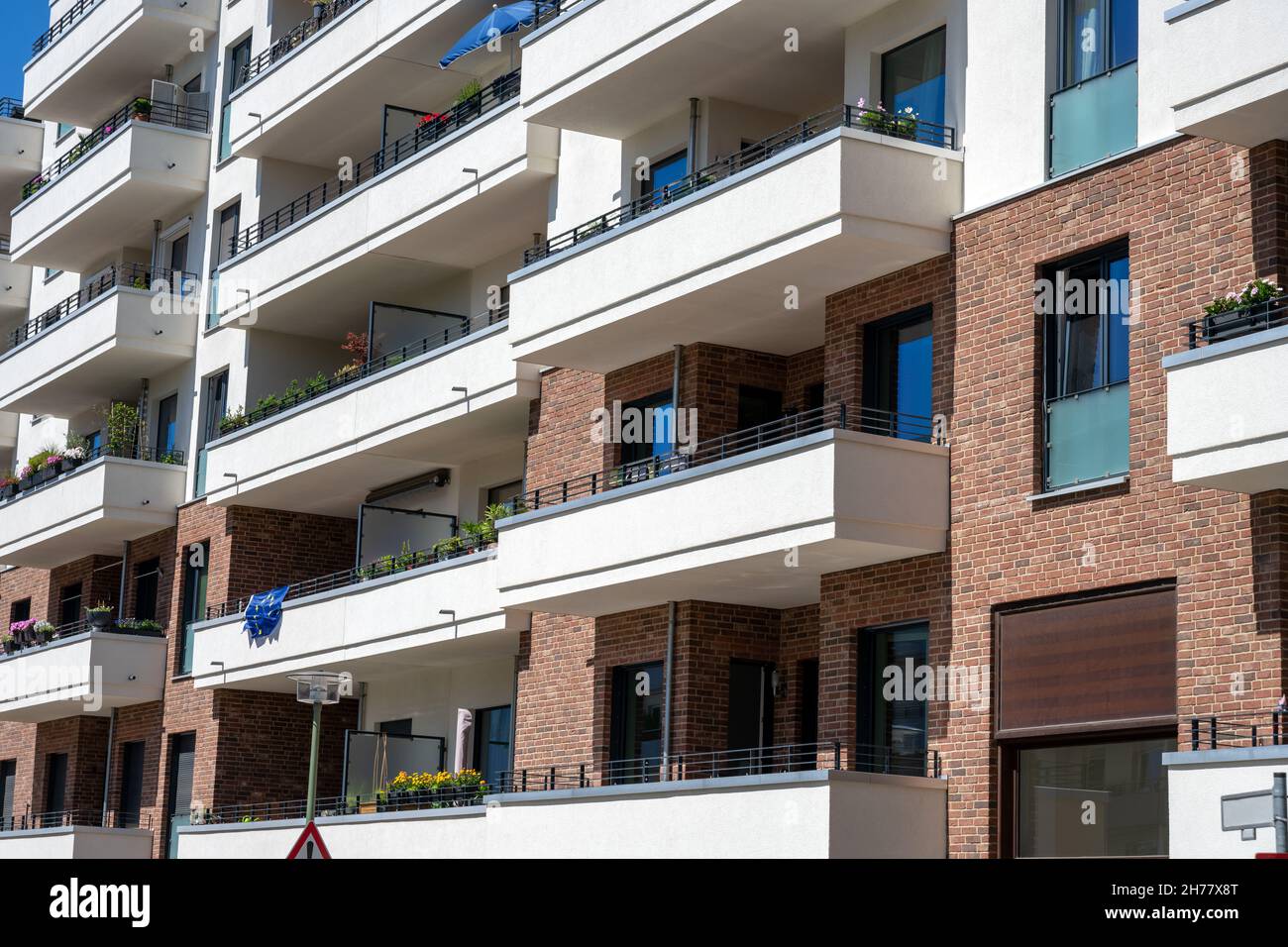 The facade of a modern apartment building with big balconies seen in Berlin, Germany Stock Photo