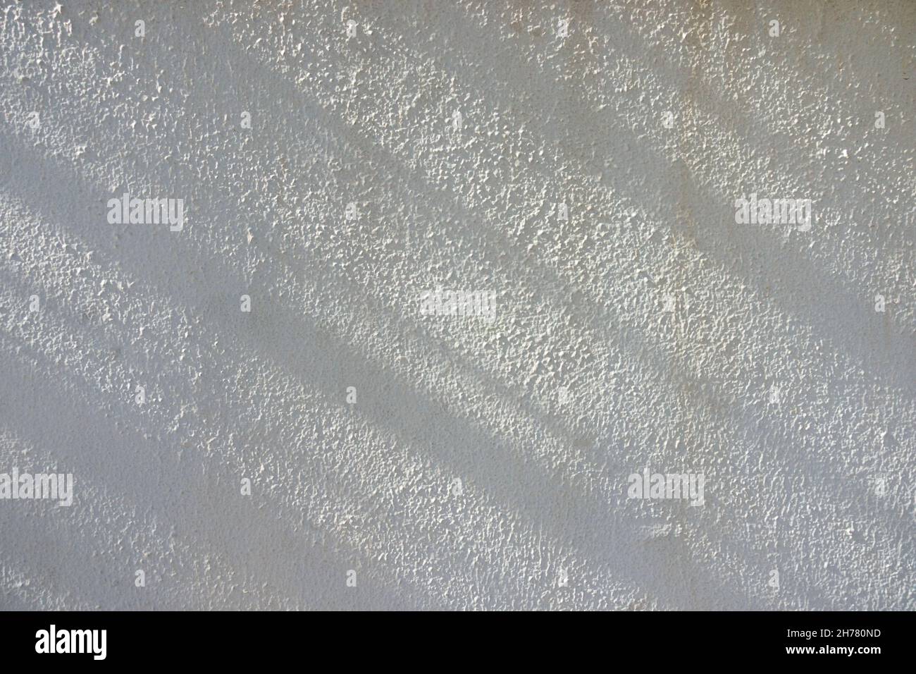 Sunlight light with abstract diagonal shadows on white wall texture background. Geometric shadows outdoors Stock Photo