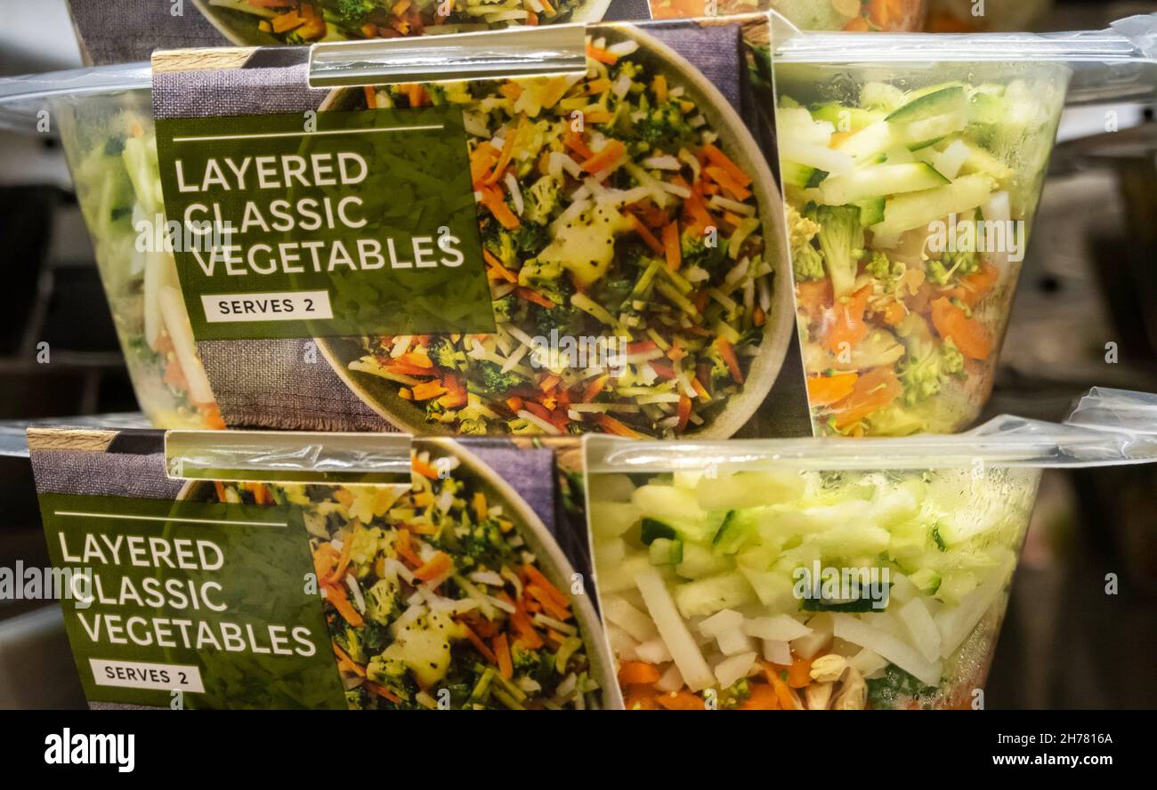 Containers of layered classic vegetables on a shelf at M&S Food Hall