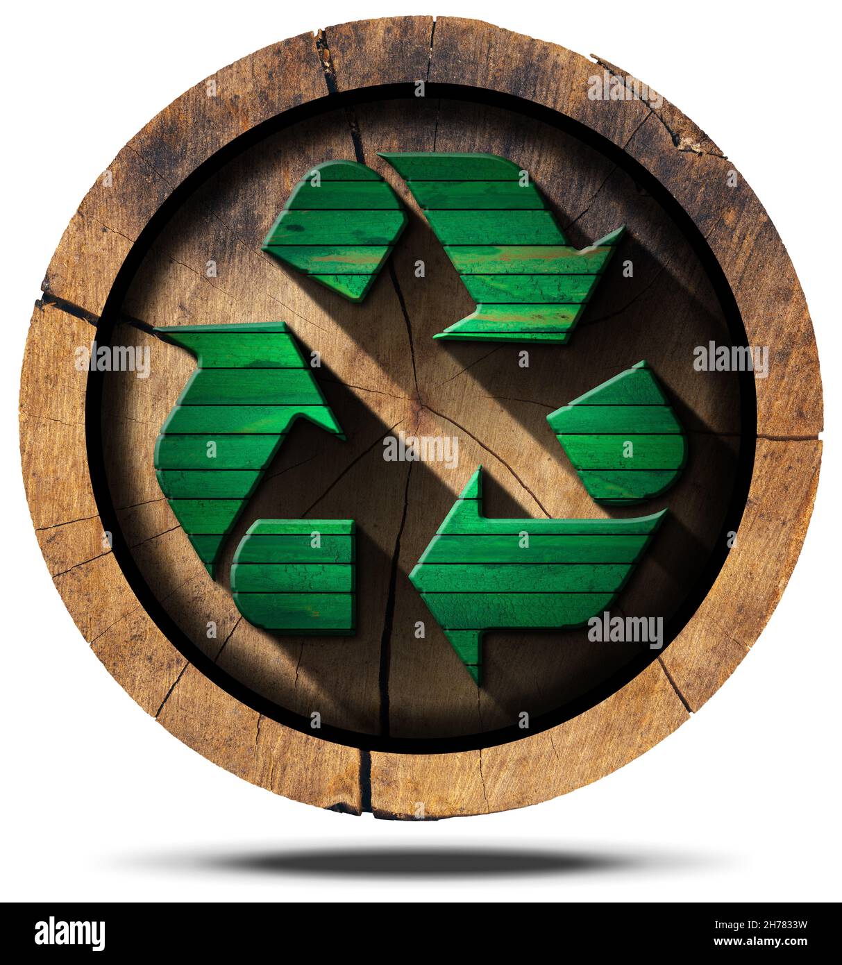 Green wooden recycling symbol on a section of tree trunk isolated on white background Stock
