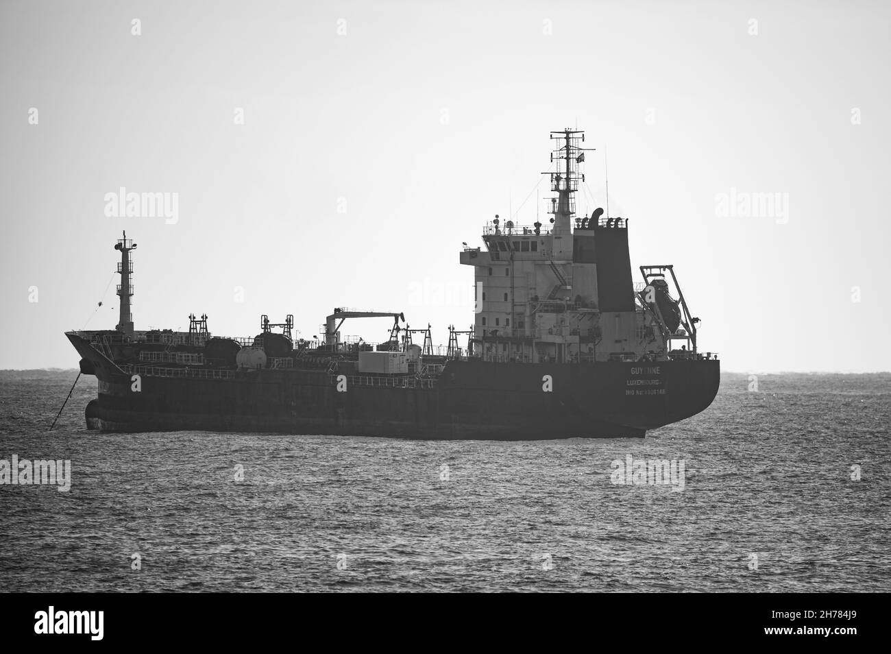 BARCELONA, SPAIN - Jan 18, 2021: A grayscale shot of a large oil tanker navigating the sea Stock Photo