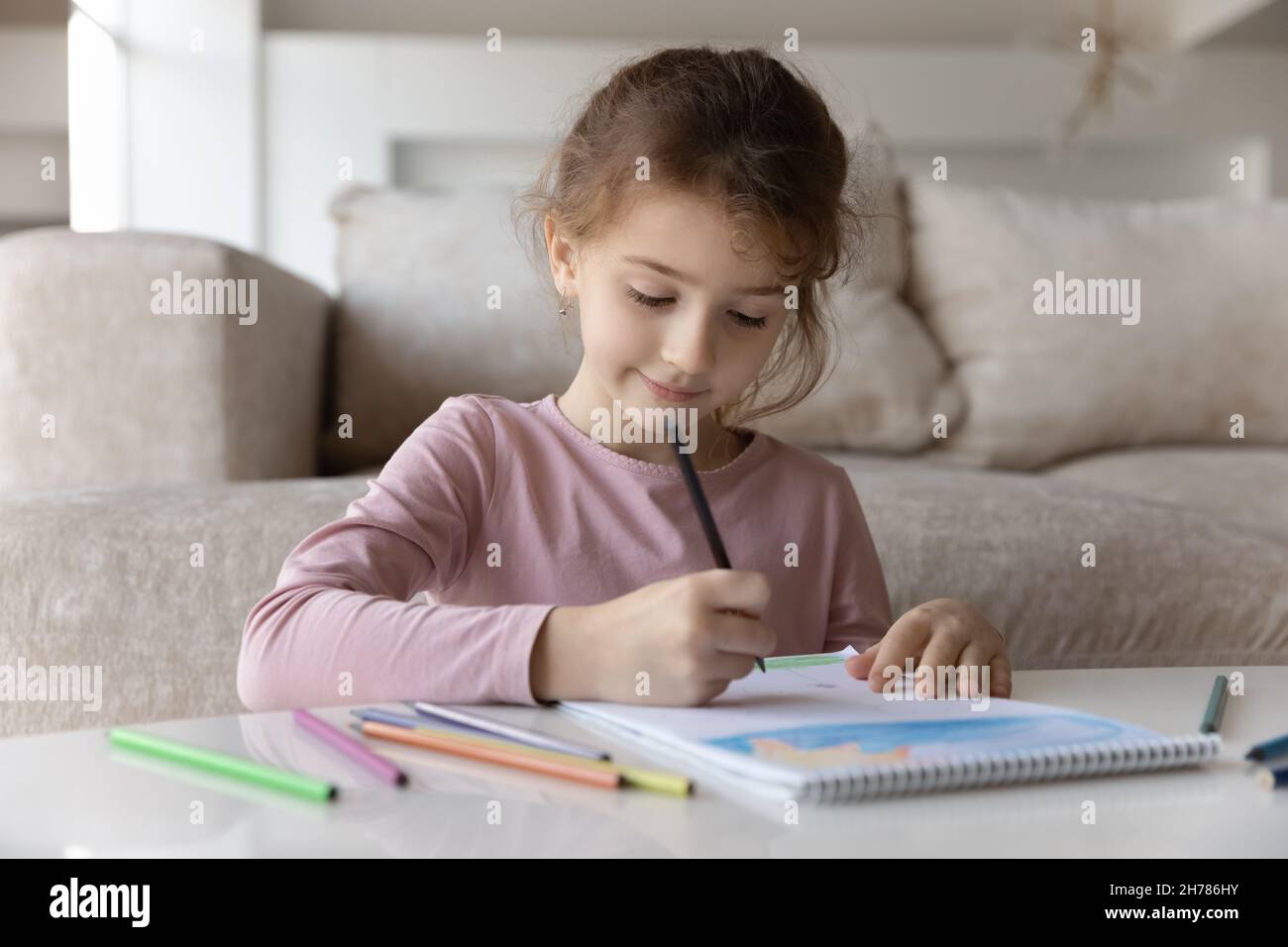 Close up cute little girl kid drawing with colorful pencils Stock Photo ...