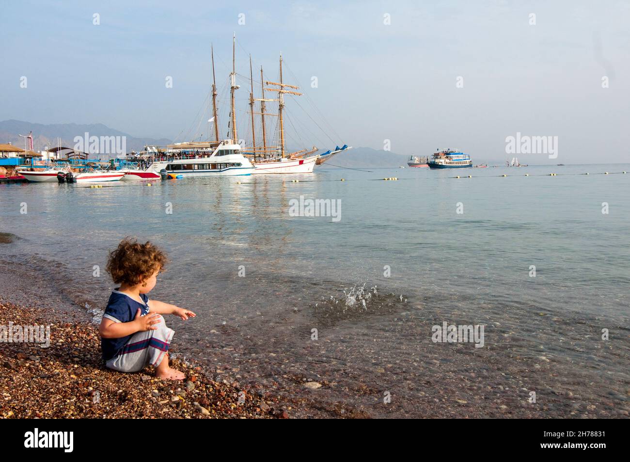 Toddler on the beach at Eilat, Israel Stock Photo