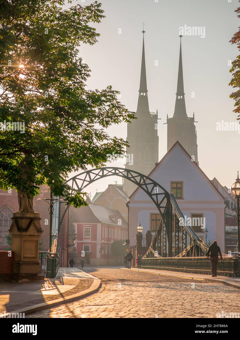 Wrocław, Poland September 2021. Tumski Bridge and Cathedral of St. John the Baptist twin towers on Ostrow Tumski. Stock Photo