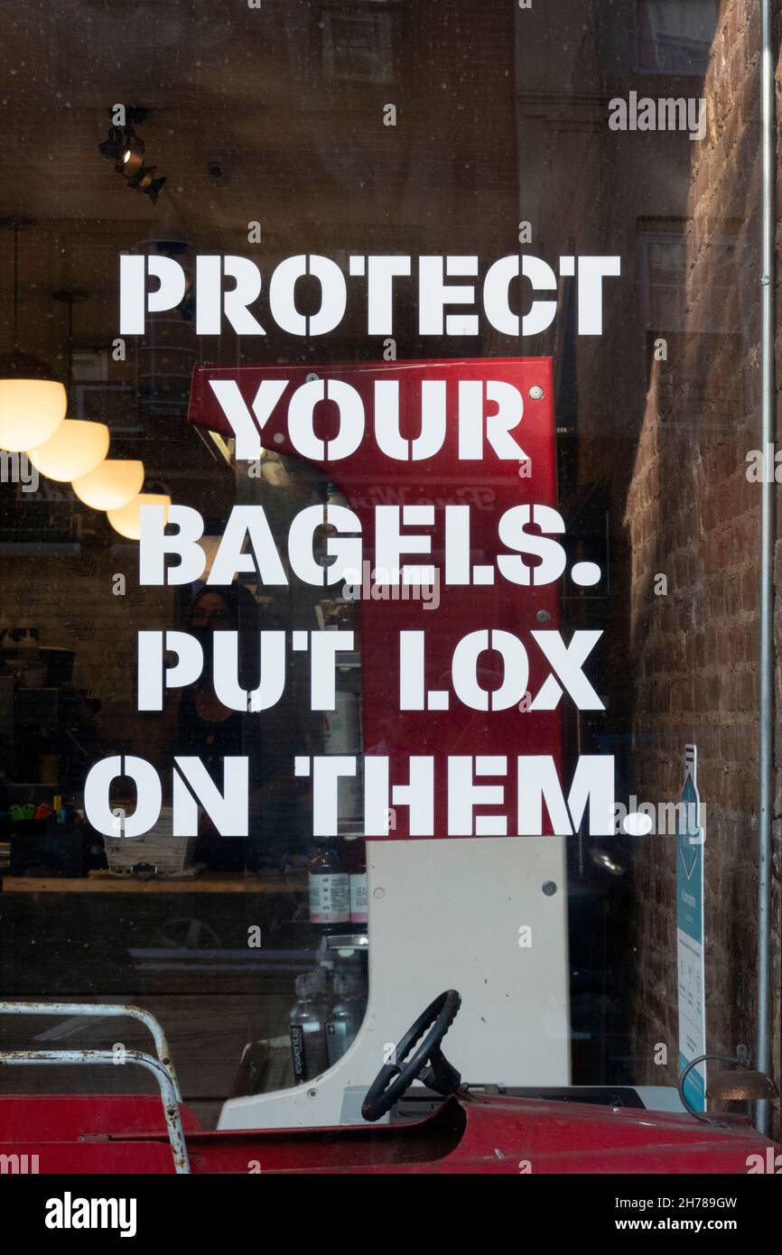 A funny sign in the window of a bagel shop in Cobble Hill, Brooklyn,, New York. Stock Photo