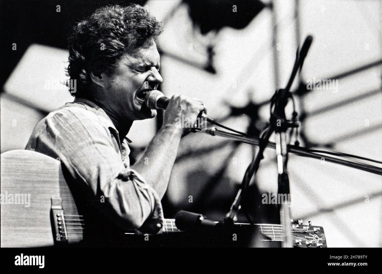 Singer songwriter Harry Chapin performing in a 1978 concert in Central Park, New York City at the Dr. Pepper Music Festival. Stock Photo