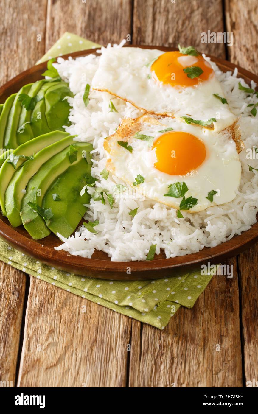 Ecuadorian simple breakfast of boiled rice and fried eggs closeup in a