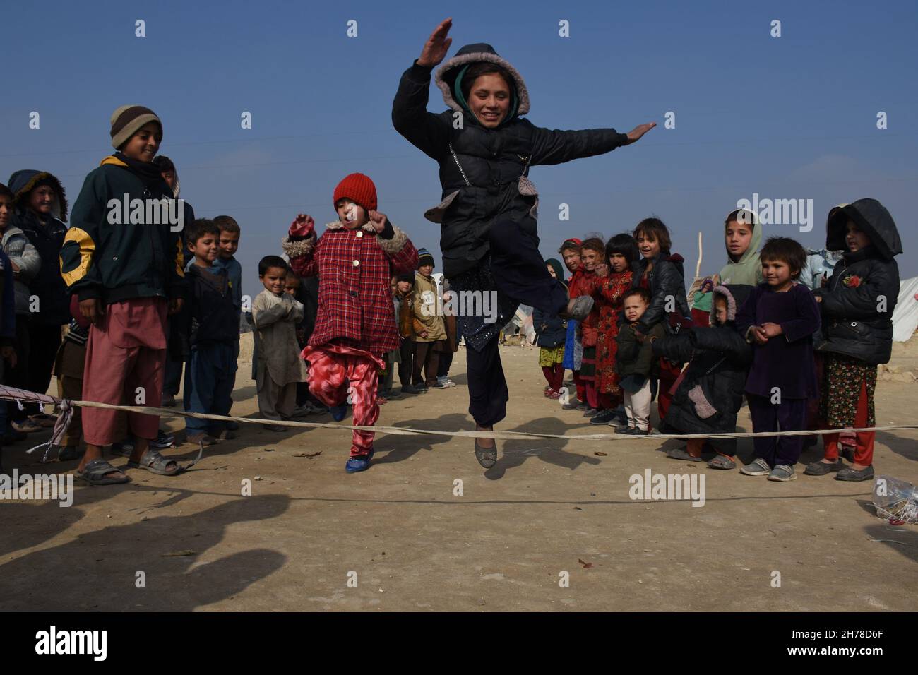 Mazar I Sharif. 21st Nov, 2021. Displaced children play at an internally displaced persons (IDPs) camp in Mazar-i-Sharif, capital of Balkh province, Afghanistan on Nov. 20, 2021. Credit: Kawa Basharat/Xinhua/Alamy Live News Stock Photo