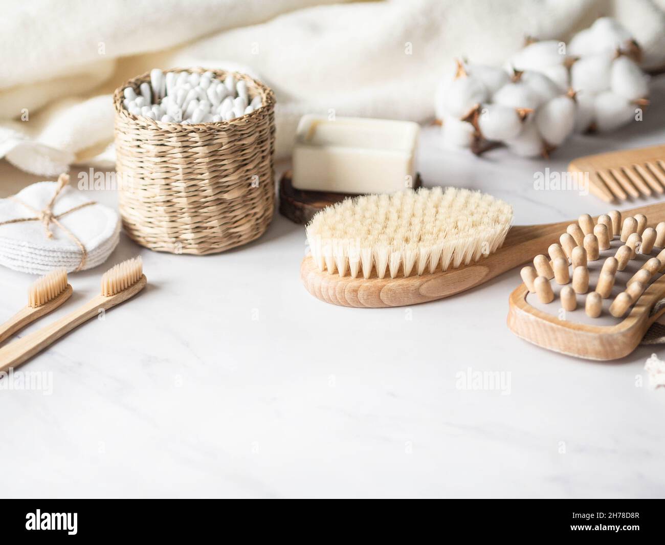 Zero waste personal bathroom accessories. Wooden brush, soap, toothbrush, cotton towel on marble background. Free plastic concept. Eco-friendly home c Stock Photo