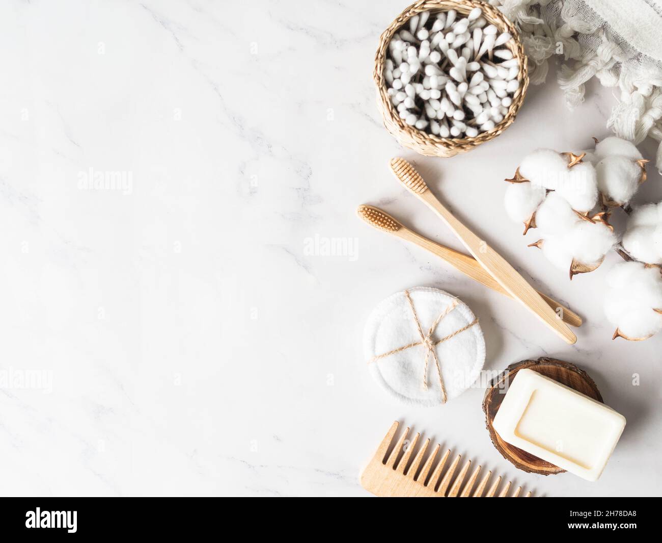 Zero waste personal bathroom accessories. Wooden brush, soap, toothbrush, cotton towel on marble background. Free plastic concept. Eco-friendly home c Stock Photo
