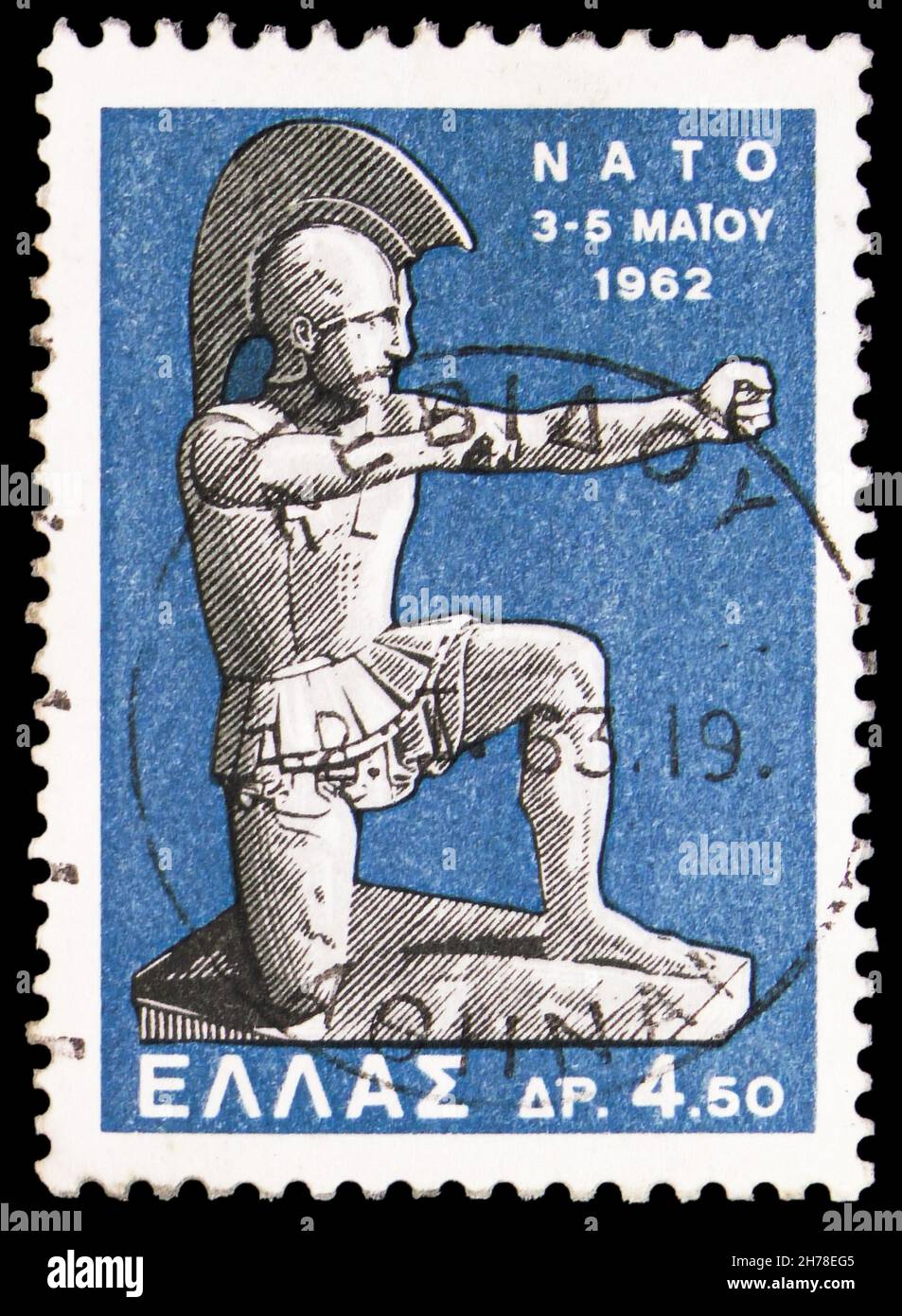 MOSCOW, RUSSIA - OCTOBER 25, 2021: Postage stamp printed in Greece shows Soldier kneeling (after Marathon tomb), N.A.T.O. Ministers Conference, Athens Stock Photo