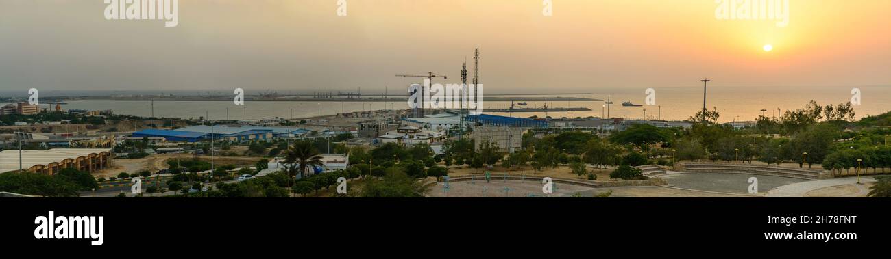 chabahar, iran 27 october 2021, panorama view from the international Port of Shahid Beheshti in chabahar with cargo ships at sunset, iran Stock Photo