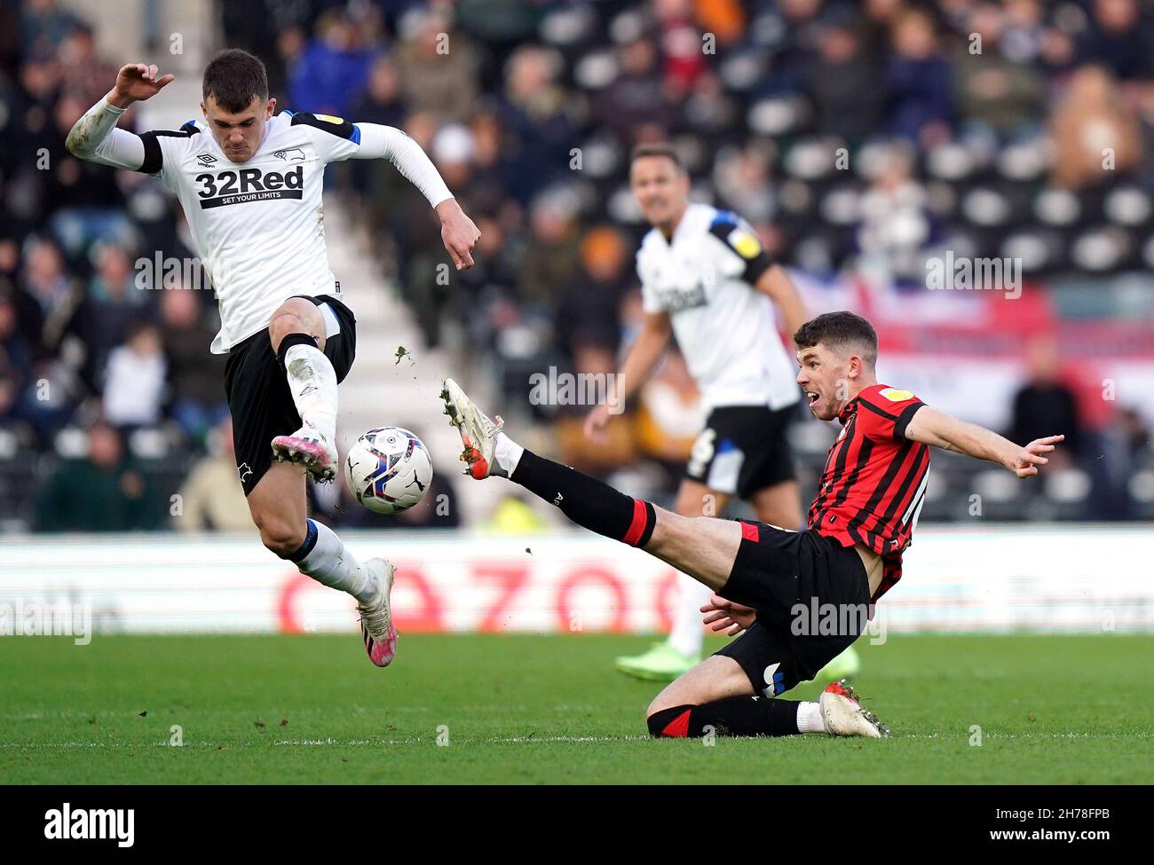Derby County's Jason Knight is tackled by Bournemouth's Ryan Christie  (right) during the Sky Bet Championship match at Pride Park Stadium, Derby.  Picture date: Sunday November 21, 2021 Stock Photo - Alamy