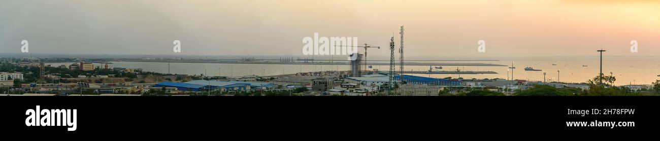 chabahar, iran 27 october 2021, panorama view from the international Port of Shahid Beheshti in chabahar with cargo ships at sunset, iran Stock Photo