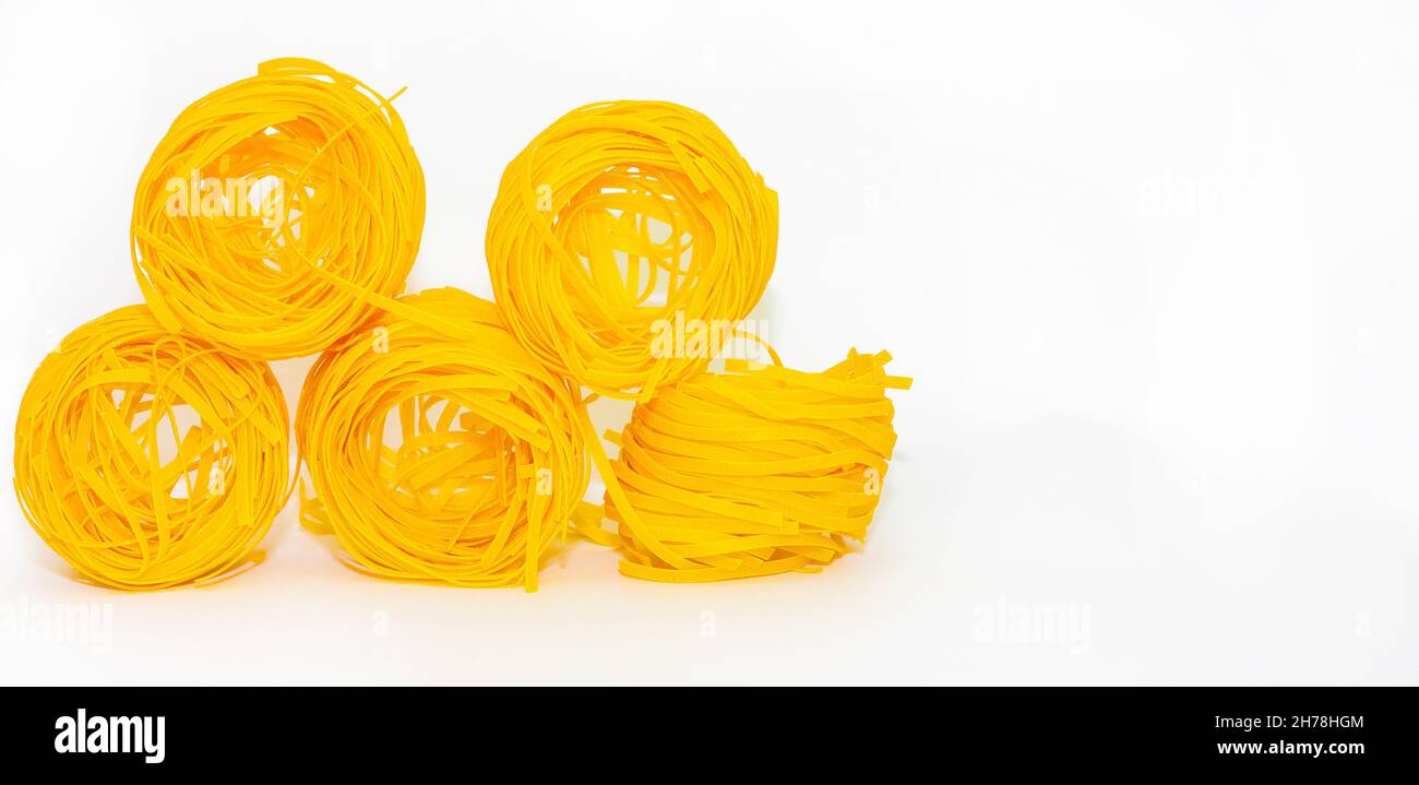 Italian egg pasta nest, great design for any purposes. Healthy vegetarian food. Italian lunch. Healthy diet. Stock Photo