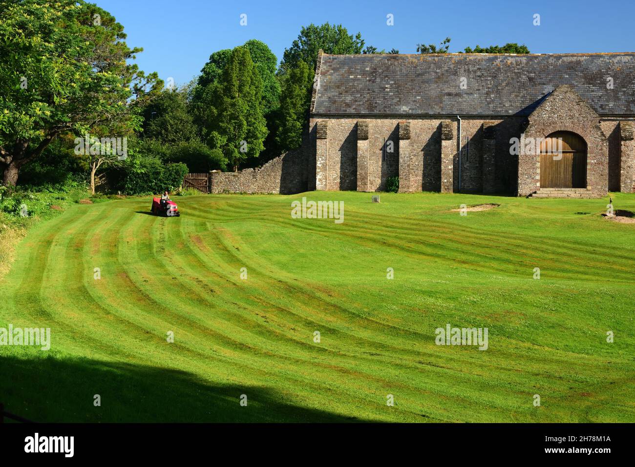 Mowing the grass at Torre Abbey golf course, in front of the Spanish ...