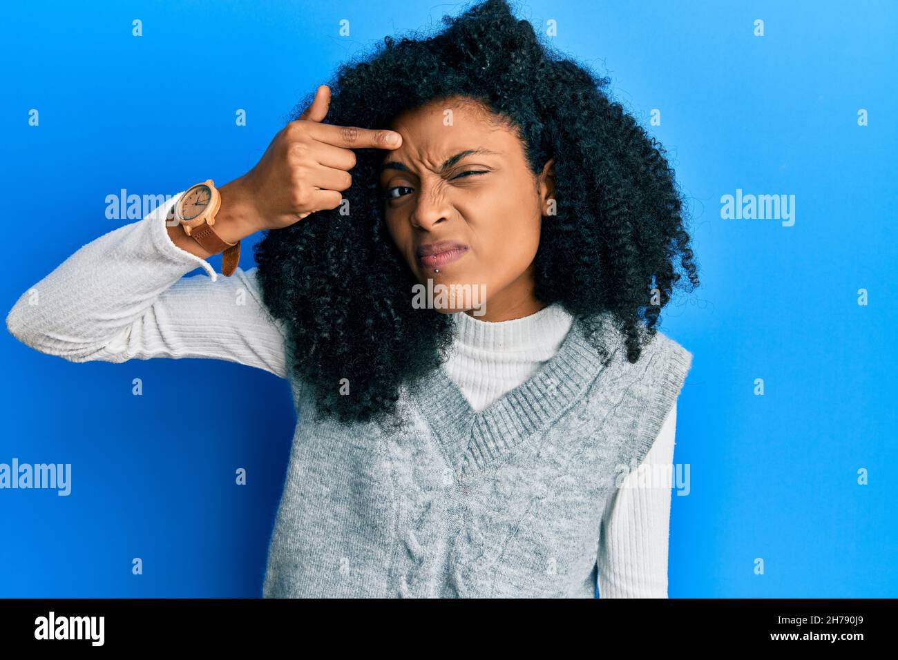 African american woman with afro hair wearing casual winter sweater ...