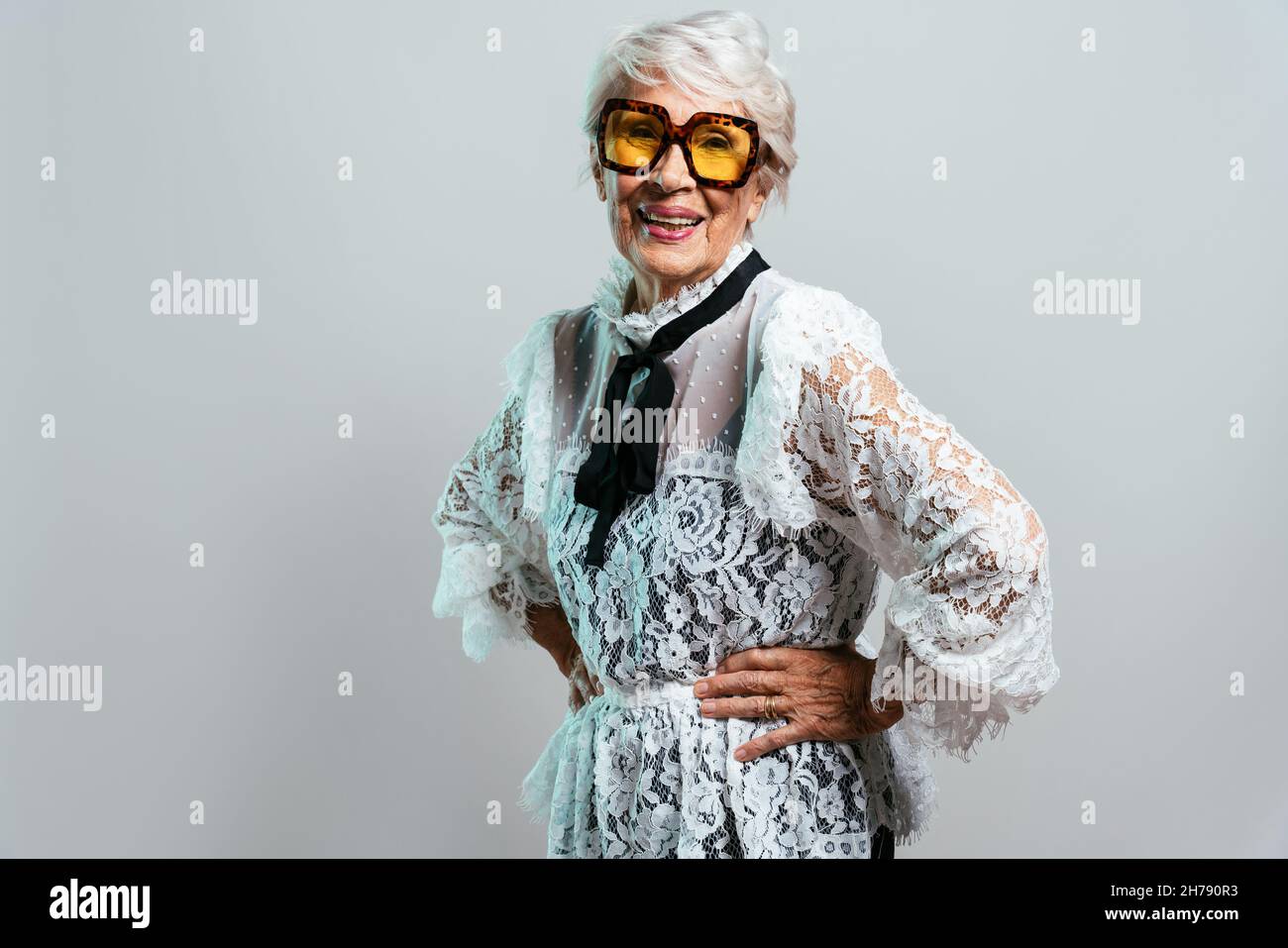 beautiful and elegant old influencer woman. Cool grandmother posing in ...