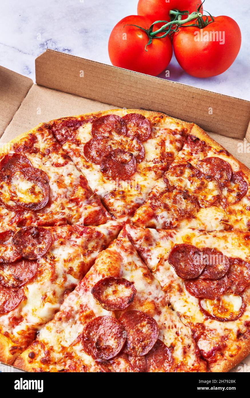 Delicious pepperoni italian pizza on a concrete surface Stock Photo Alamy