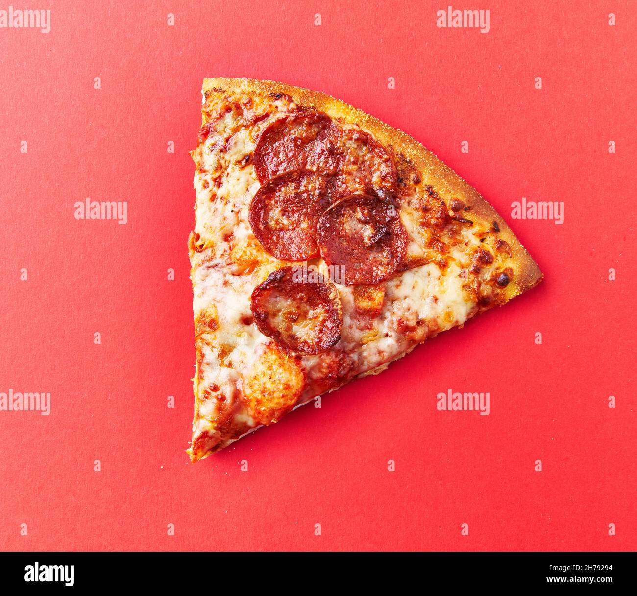 Slice of pepperoni italian pizza on a red background Stock Photo Alamy