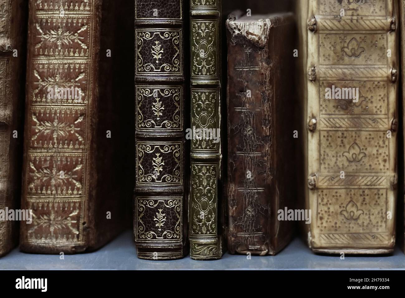 Old worn books on a shelf in the library's archives Stock Photo - Alamy