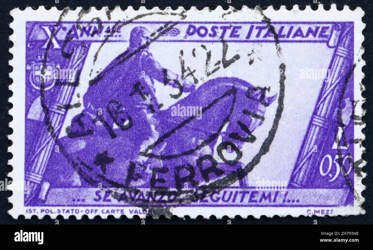 ITALY - CIRCA 1932: a stamp printed in the Italy shows Mussolini Statue, Bologna, 10th Anniversary of the Fascist Government and the March on Rome, ci Stock Photo