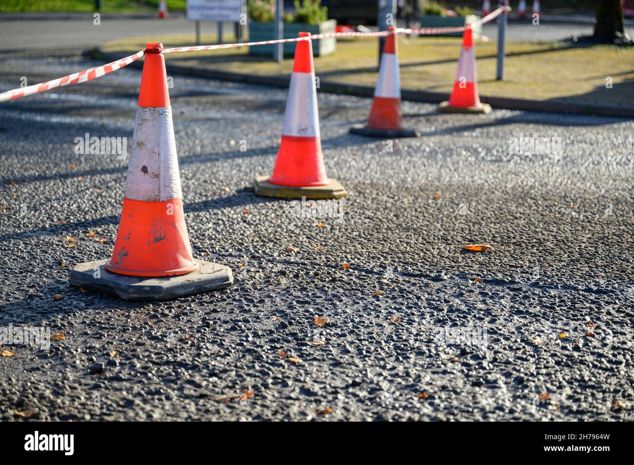 Road works. Orange traffic cones in the middle of the street. Stock Photo