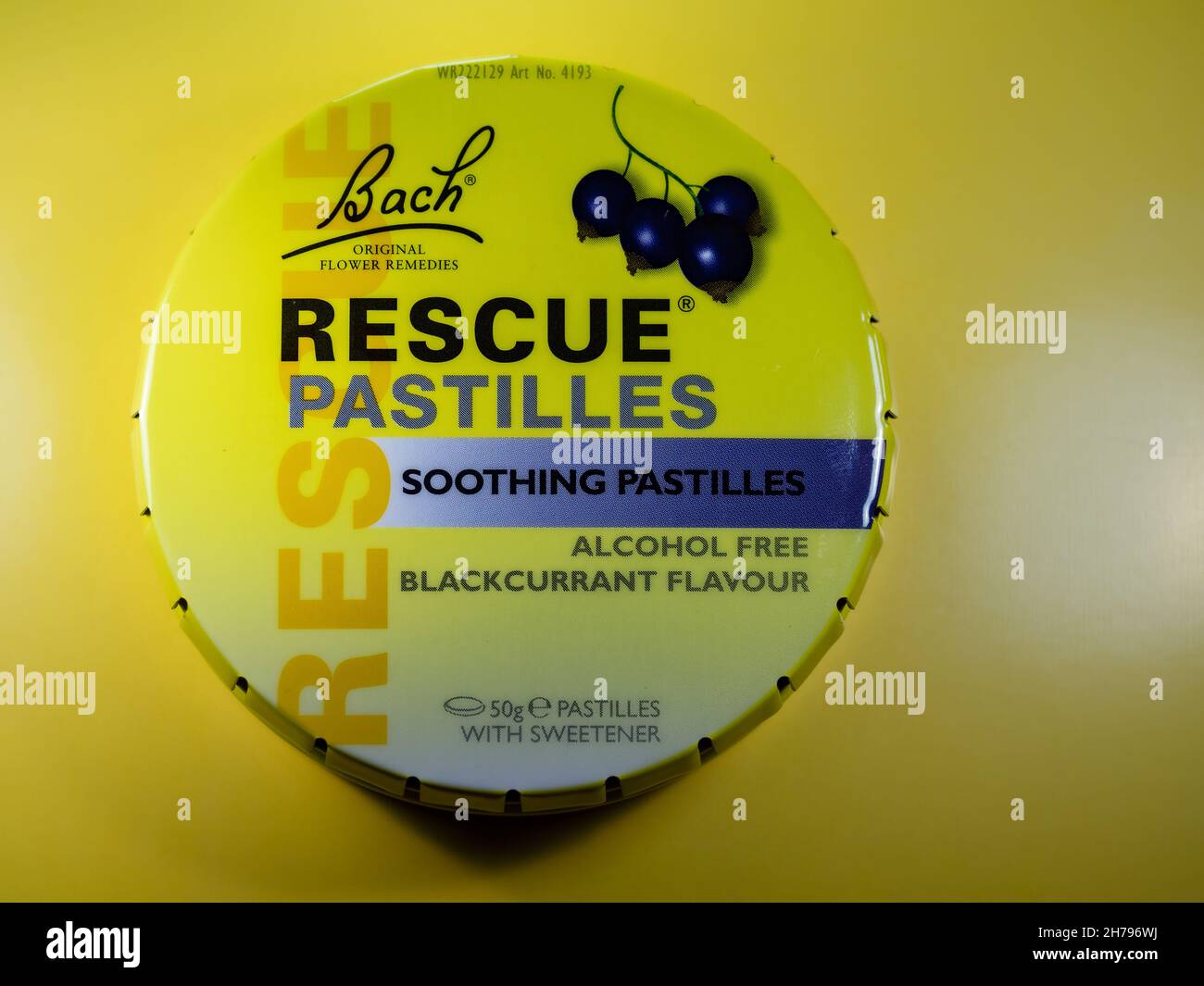Bachs rescue relief pastilles tin on a yellow background Stock Photo