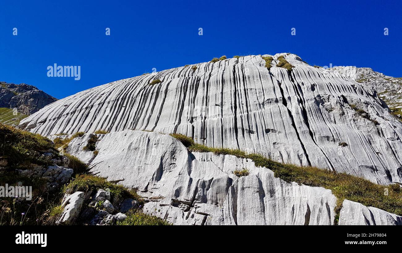Steep rock face in the Swiss Alps. Praettigau, Grisons, Switzerland. Stock Photo