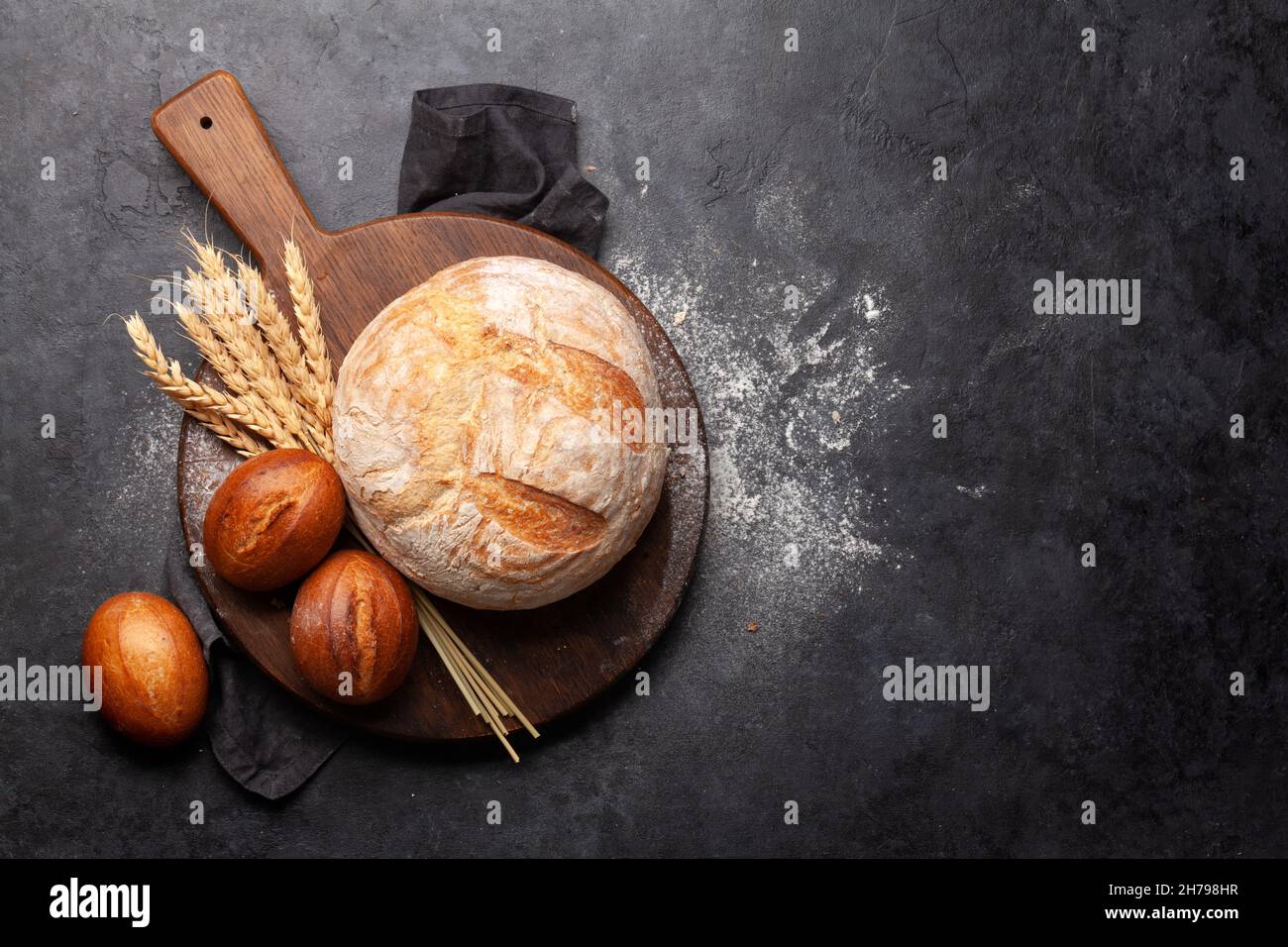 Fresh homemade bread on stone table. Top view flat lay with copy space ...