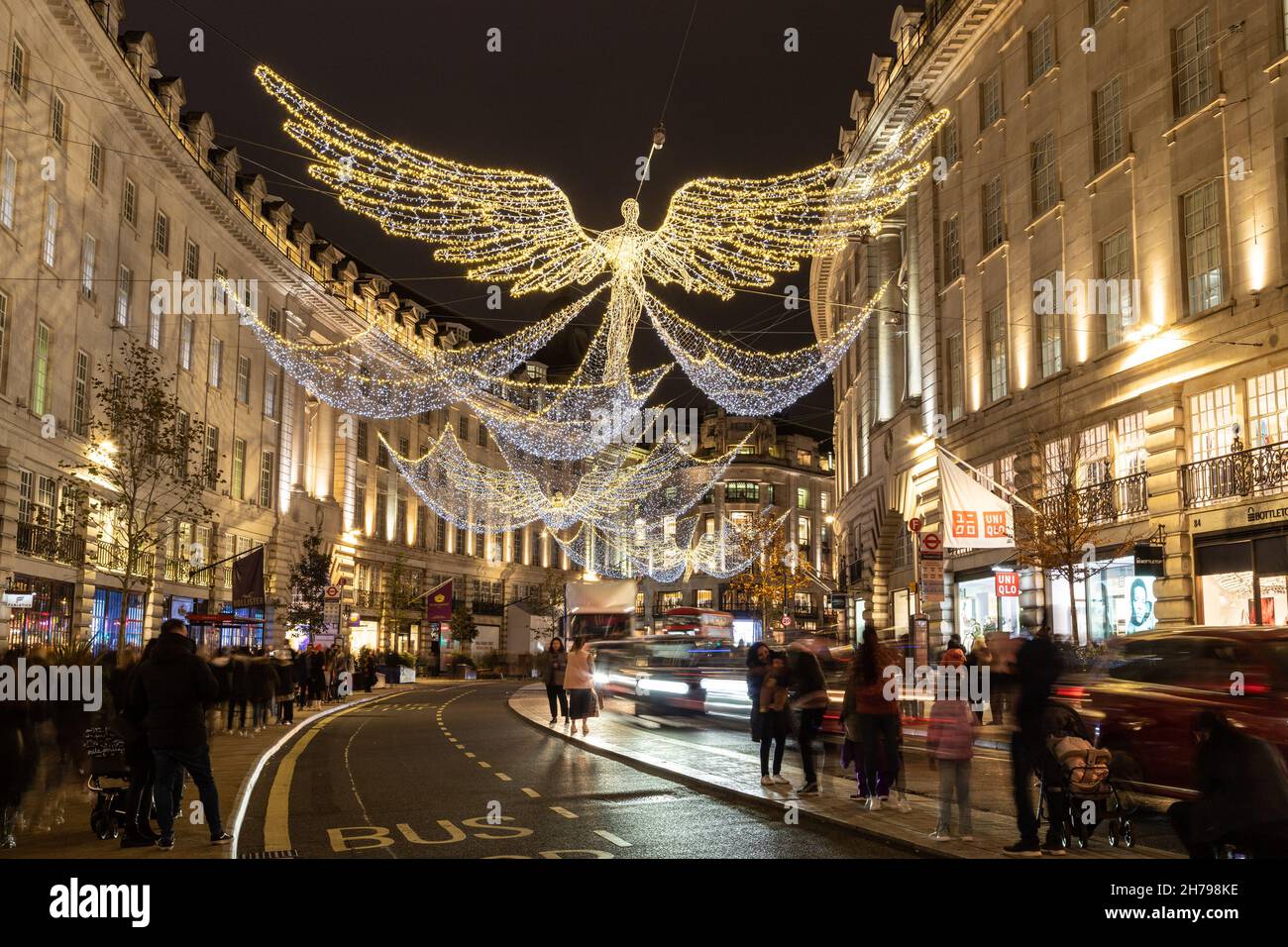 LONDON, UK - 20TH NOV 2021: Views along Regent Street in London at Christmas showing the decorations and outside of shops. People can be seen outside. Stock Photo