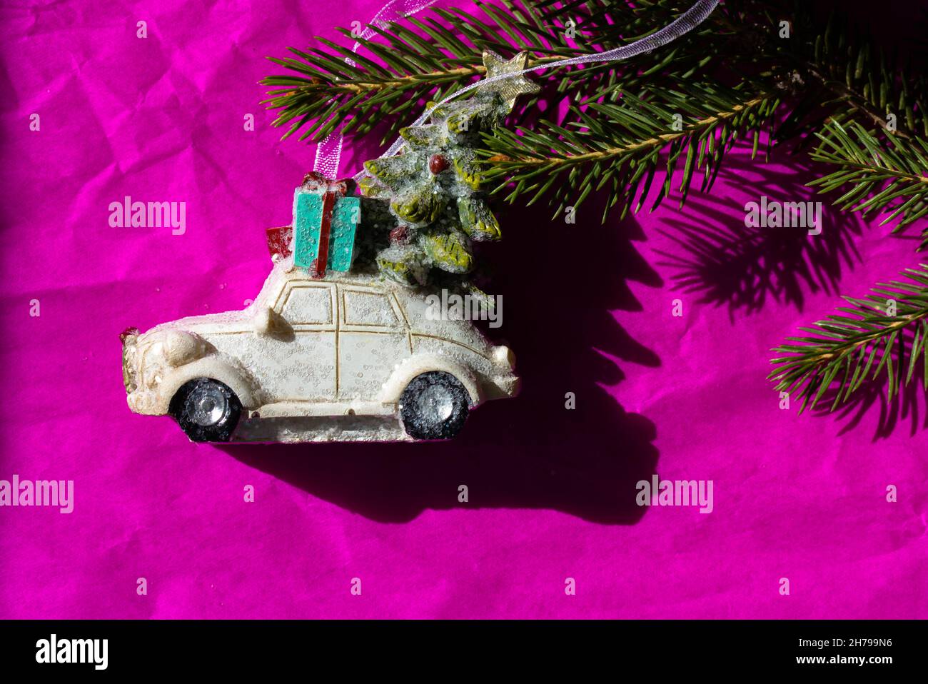Got Car For Christmas 2022 Retro Toy Car. Christmas Tree, Gift Box On A Bright Pink Backdrop. New Year  2022 Stock Photo - Alamy
