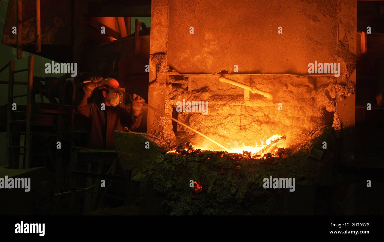 Close up of blast furnace smelting liquid steel at the hot shop of the ...