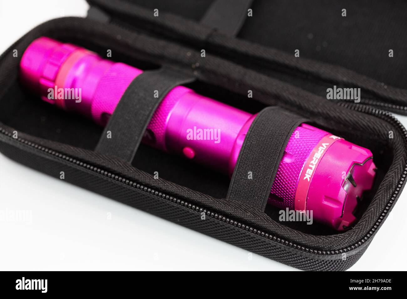 Close up of a pink Vipertek stun gun in a black carrying case. Stock Photo